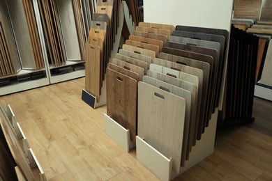 Many different samples of wooden flooring in store