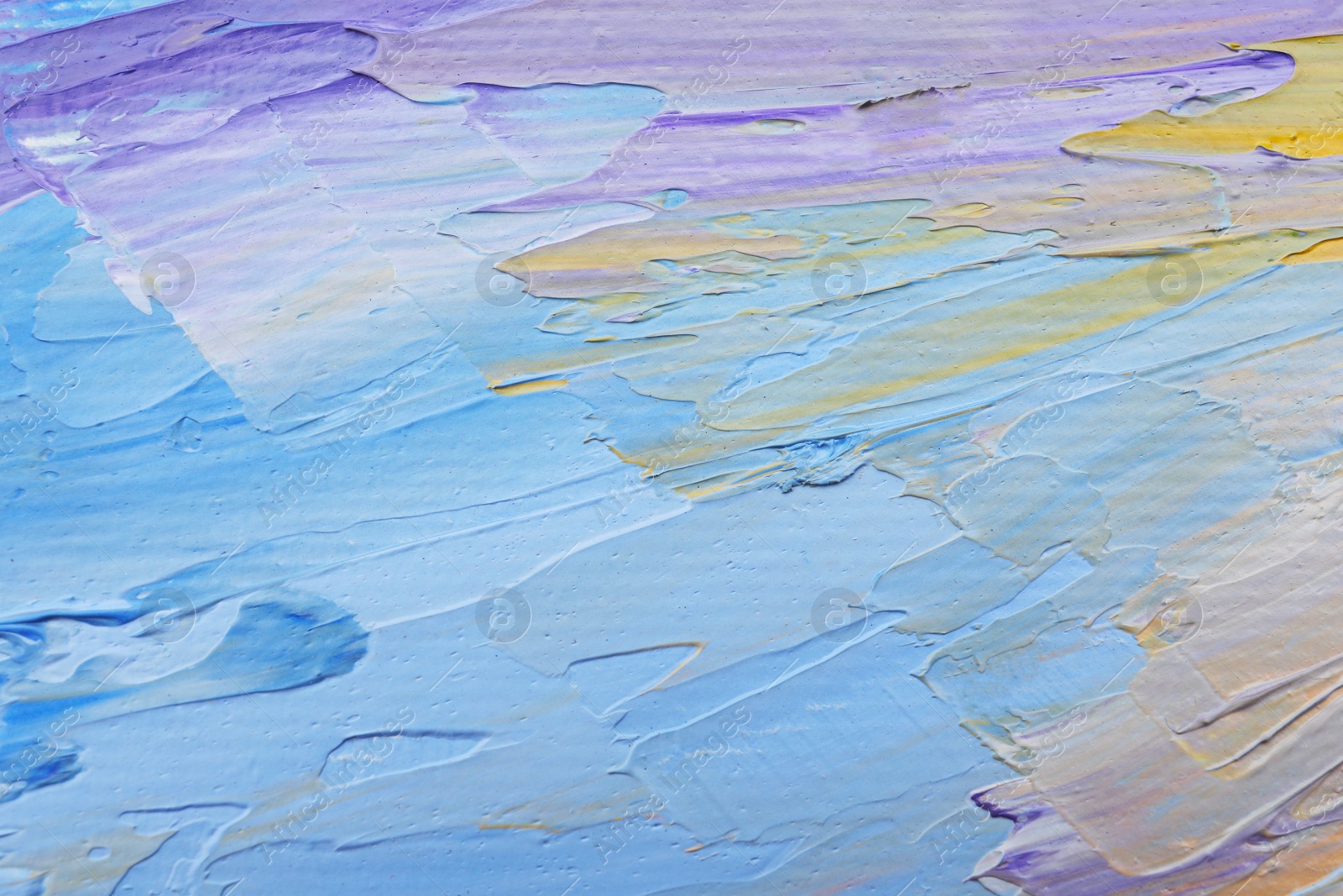 Photo of Beautiful strokes of pastel oil paints as background, closeup