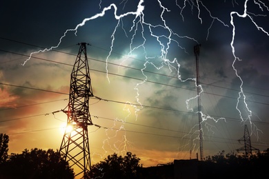 Image of Picturesque lightning storm over high voltage towers
