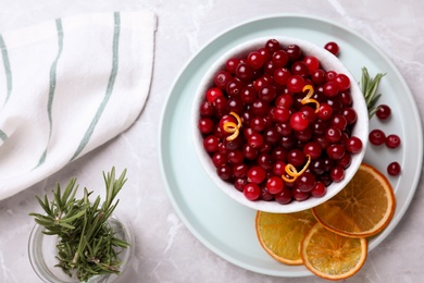 Flat lay composition with fresh ripe cranberries on light table