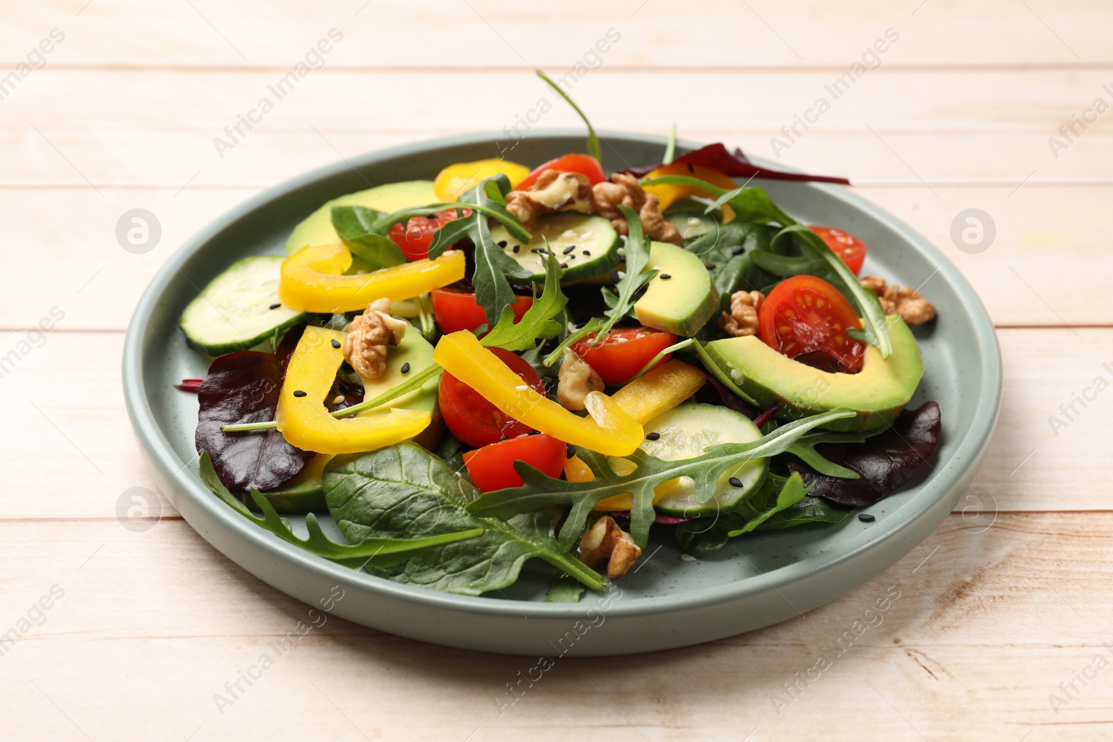 Photo of Balanced diet and vegetarian foods. Plate with different delicious products on wooden table, closeup