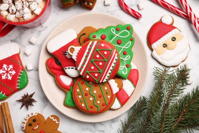 Photo of Flat lay composition with decorated Christmas cookies on white marble table