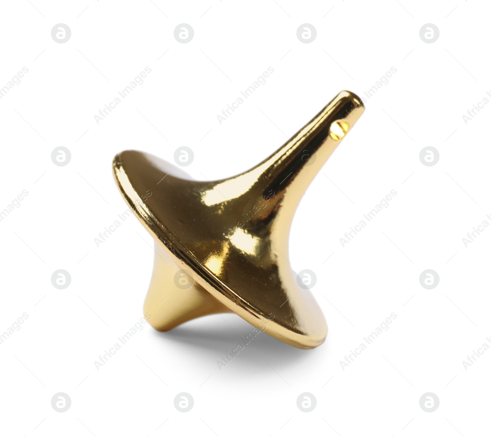 Photo of One golden spinning top on white background