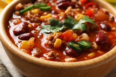 Photo of Bowl with tasty chili con carne, closeup view