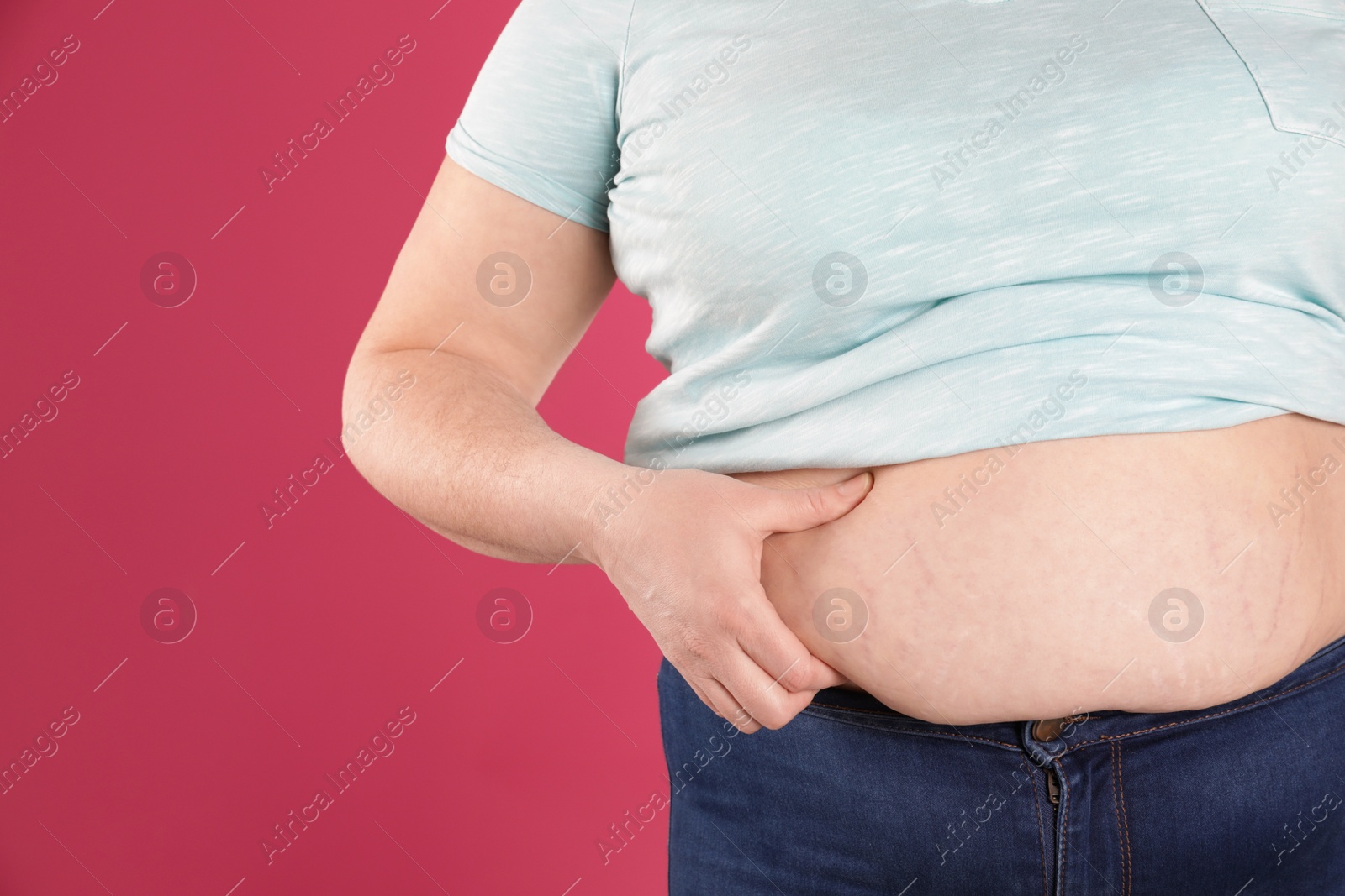 Photo of Overweight woman on color background, closeup. Space for text