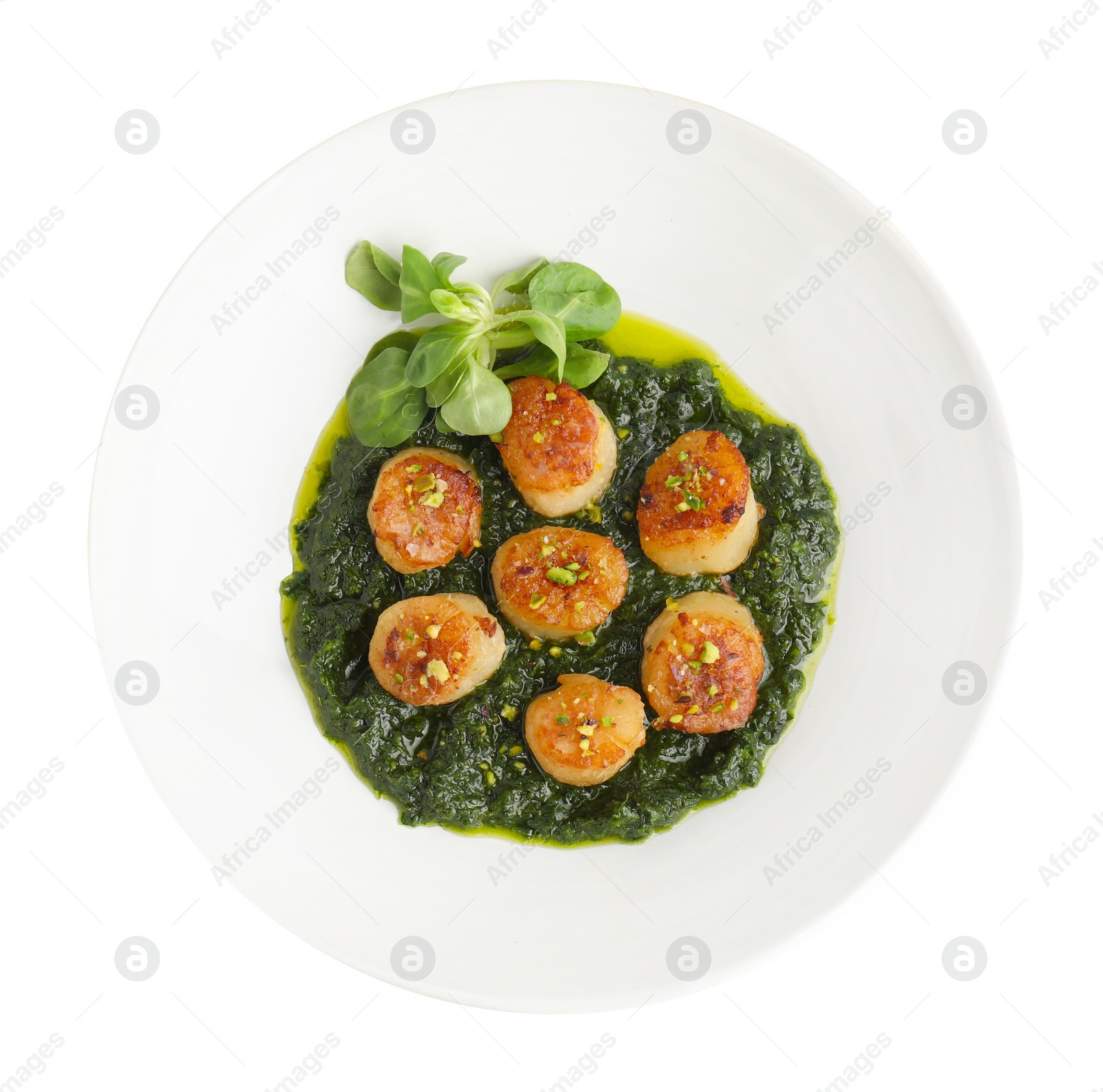 Photo of Delicious fried scallops with tasty sauce and corn salad in bowl isolated on white, top view