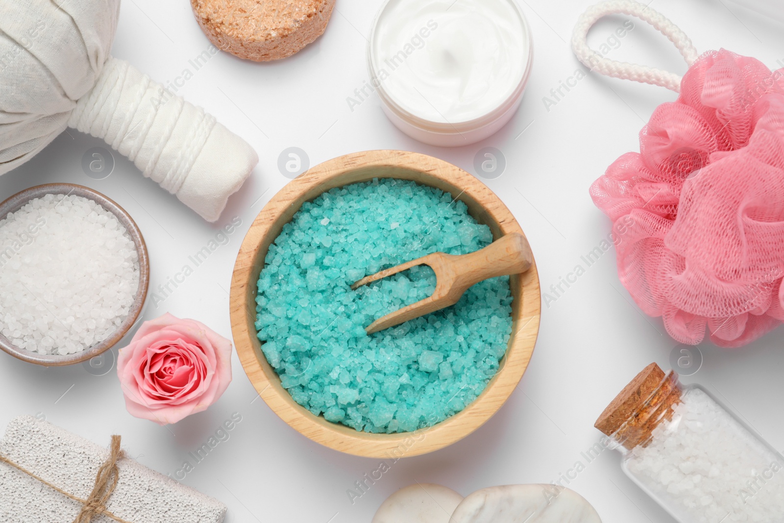 Photo of Beautiful spa composition with herbal massage bag and different care products on white background, flat lay