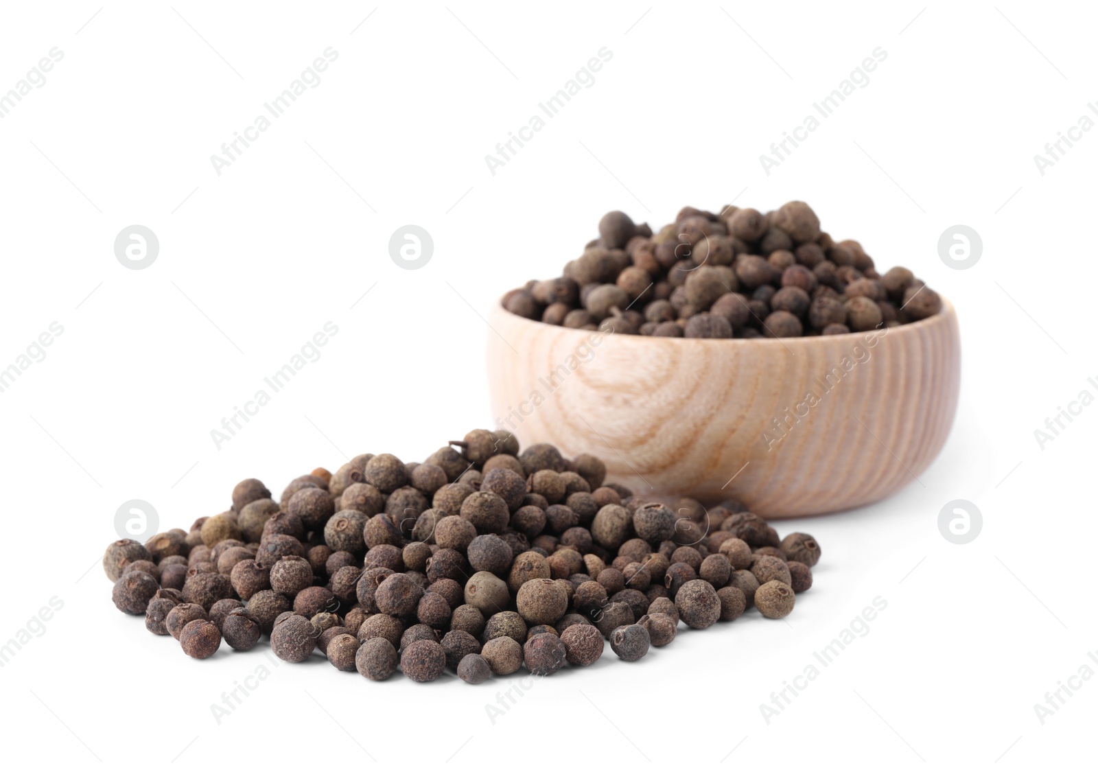 Photo of Spicy black pepper grains isolated on white