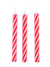 Photo of Red striped birthday candles isolated on white