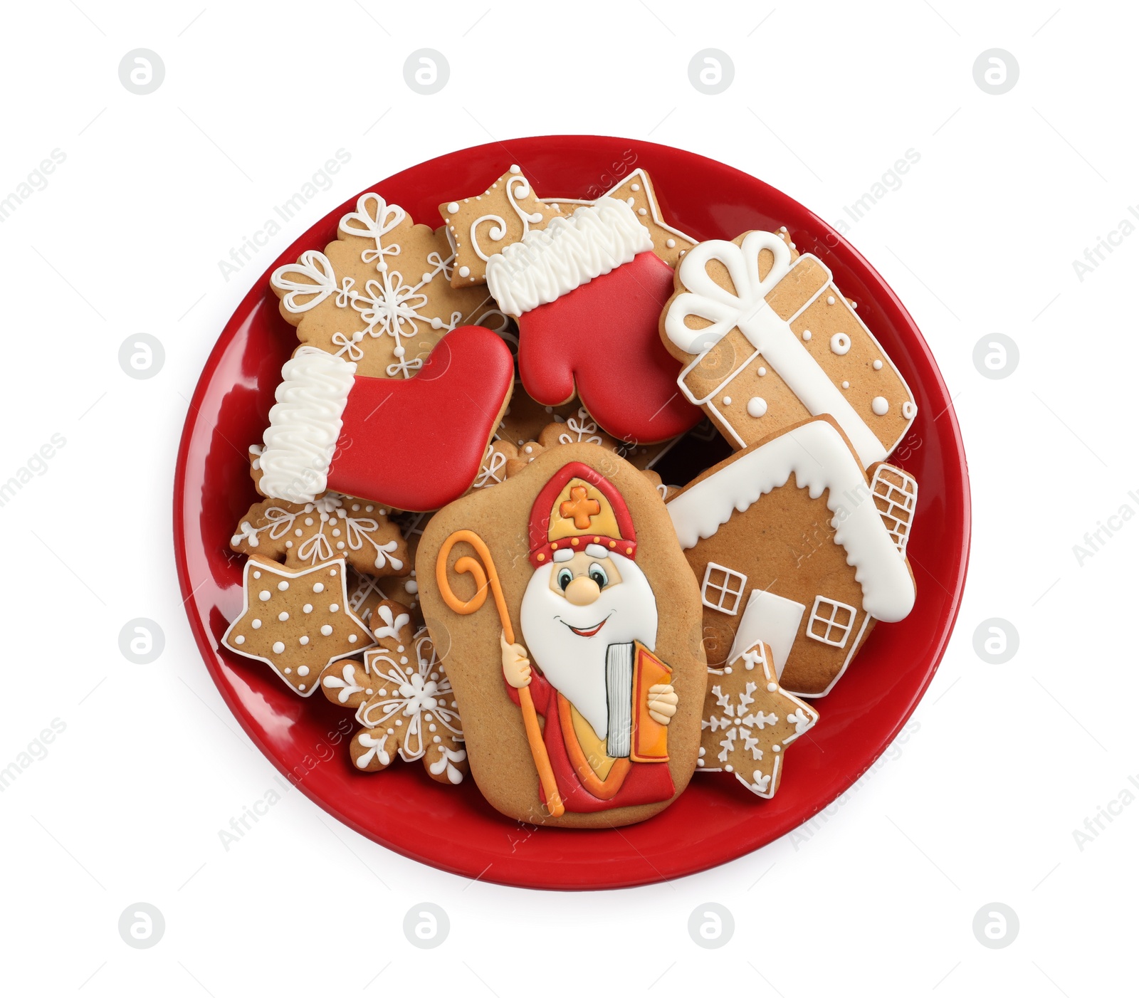 Photo of Tasty gingerbread cookies on white background, top view. St. Nicholas Day celebration