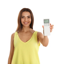 Photo of Young woman with air conditioner remote on white background