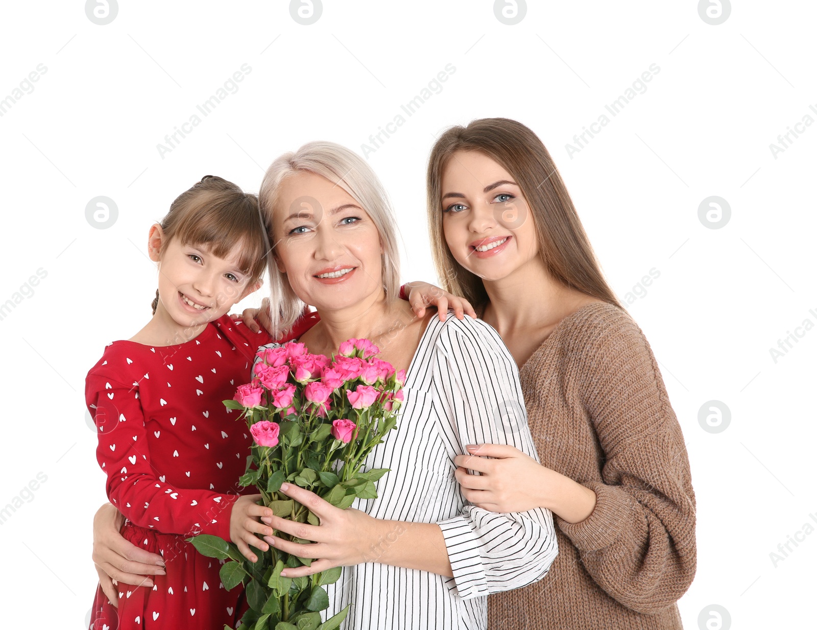 Photo of Beautiful mature lady, daughter and grandchild with flowers on white background. Happy Women's Day