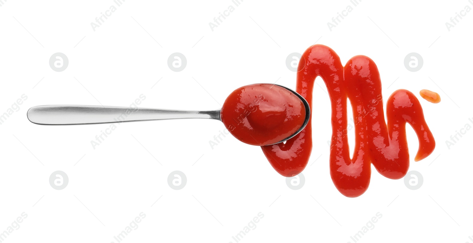 Photo of Tasty ketchup and spoon isolated on white, top view
