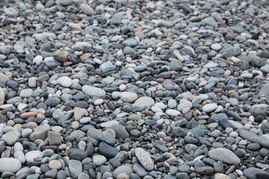 Photo of Surface covered with many different pebbles as background