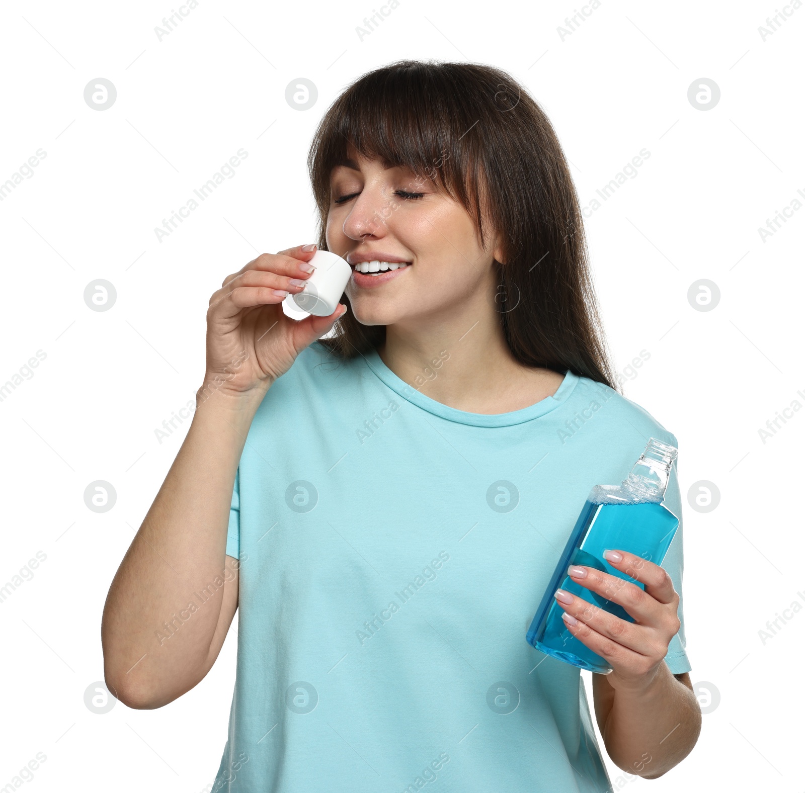 Photo of Young woman using mouthwash on white background