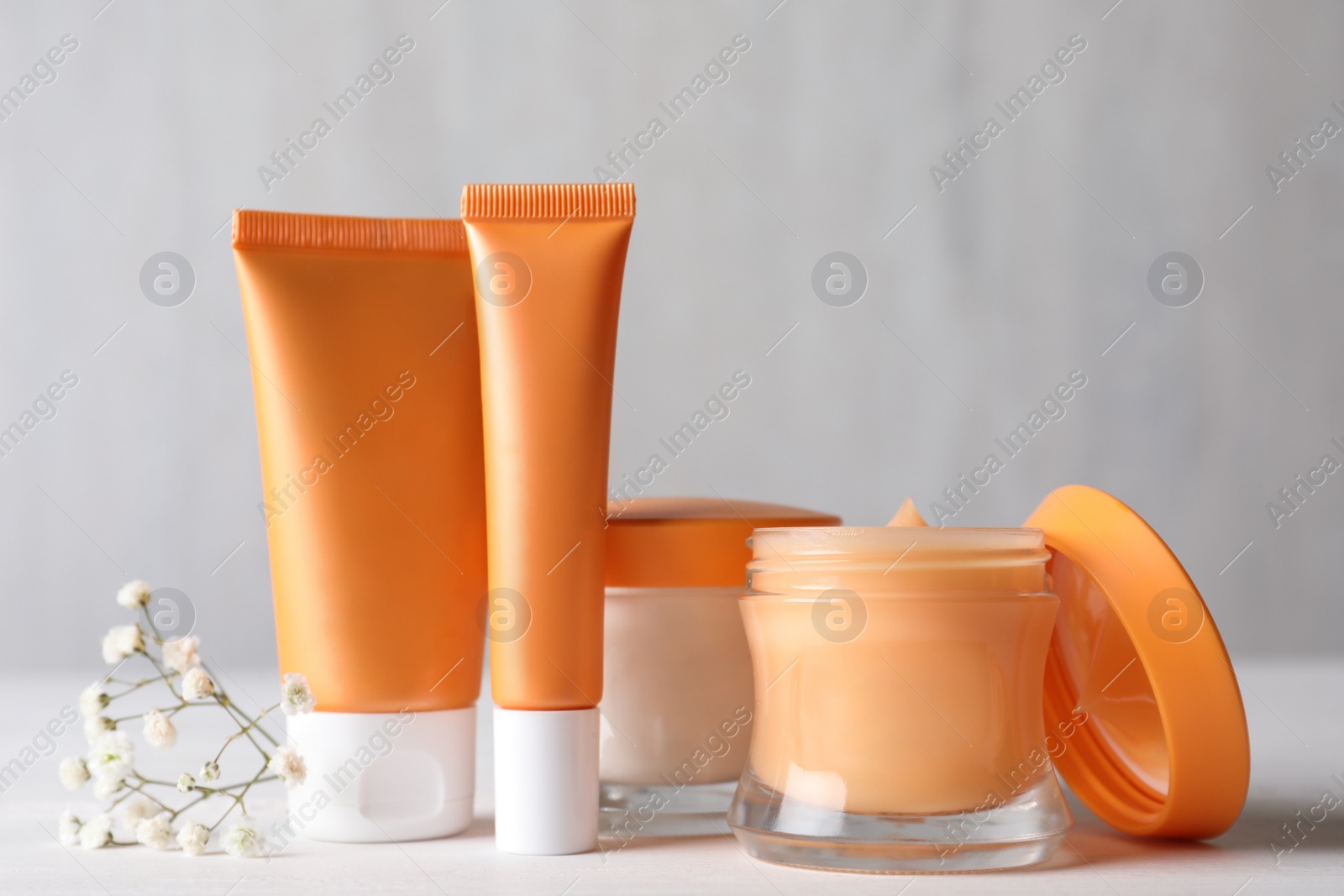 Photo of Set of luxury cosmetic products on white table
