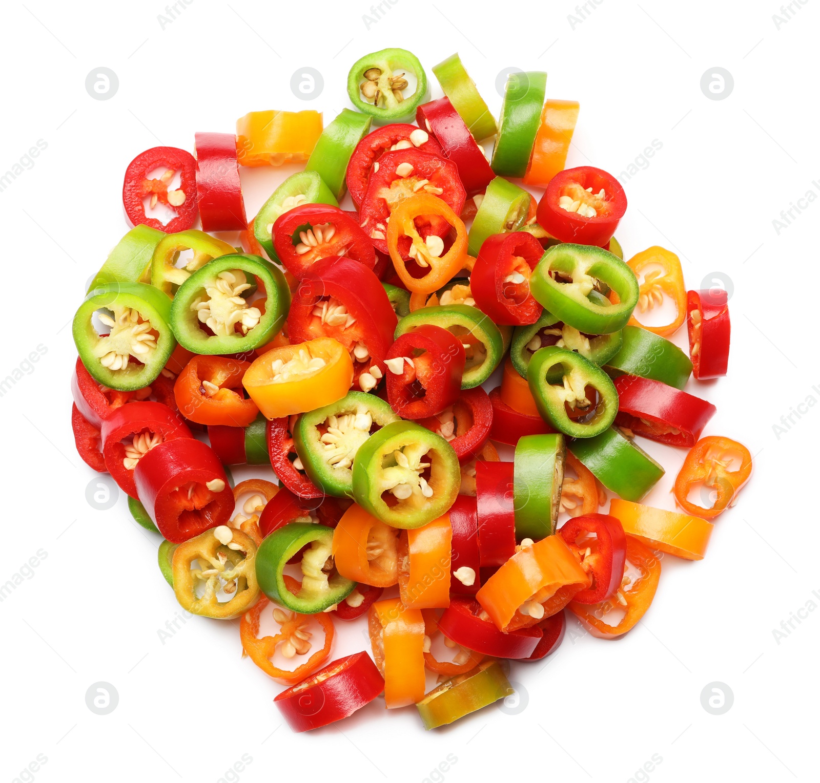 Photo of Pile of different cut hot chili peppers on white background, top view