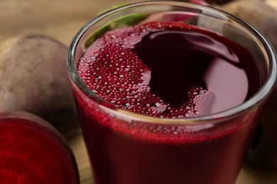 Photo of Freshly made beet juice in glass, closeup view