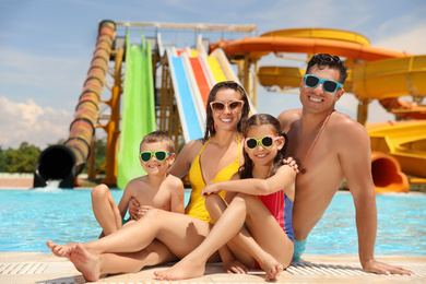 Happy family at water park. Summer vacation