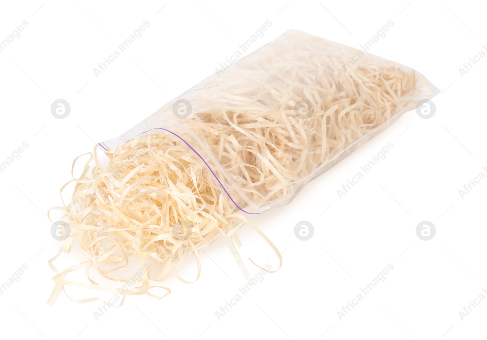 Photo of Wood shavings in zip bag isolated on white