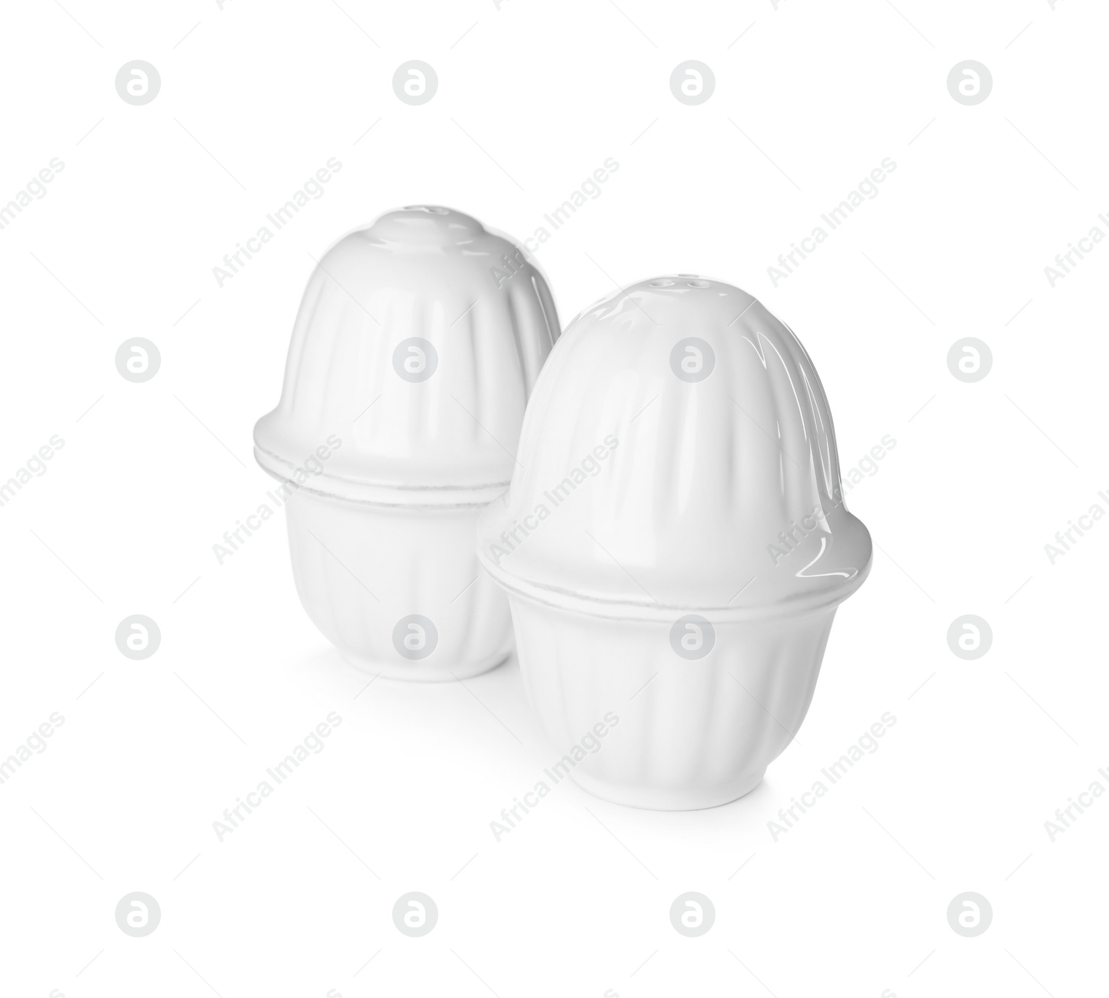 Photo of Ceramic egg cups with lids on white background