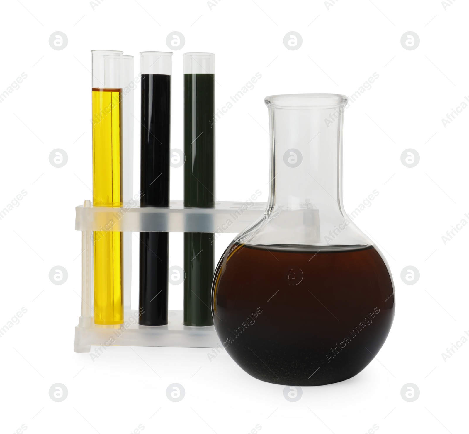 Photo of Laboratory glassware with different types of crude oil isolated on white