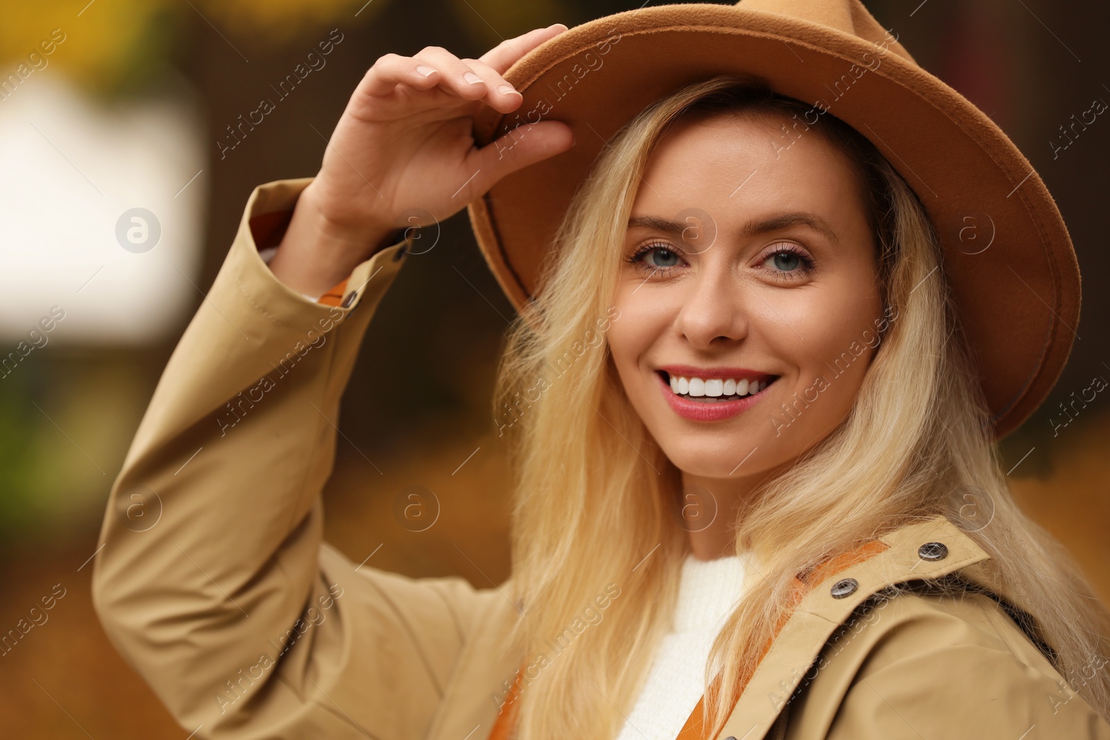 Photo of Autumn vibes. Portrait of happy woman outdoors