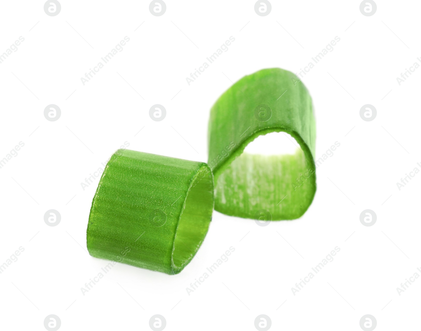 Photo of Pieces of fresh green onion isolated on white