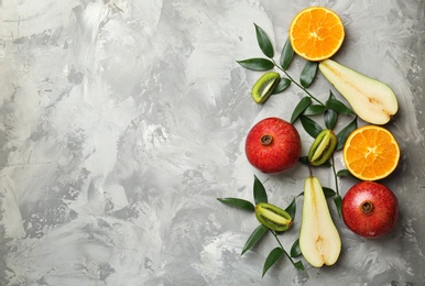 Photo of Set of fresh tropical fruits on grey background