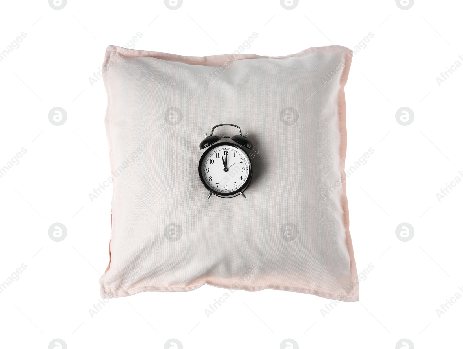 Photo of Soft decorative pillow with alarm clock on white background