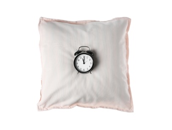 Photo of Soft decorative pillow with alarm clock on white background