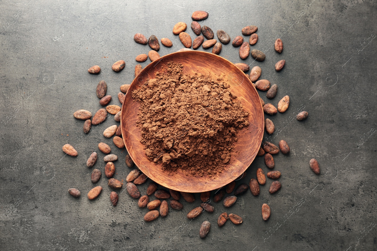 Photo of Flat lay composition with cocoa powder and beans on grey background