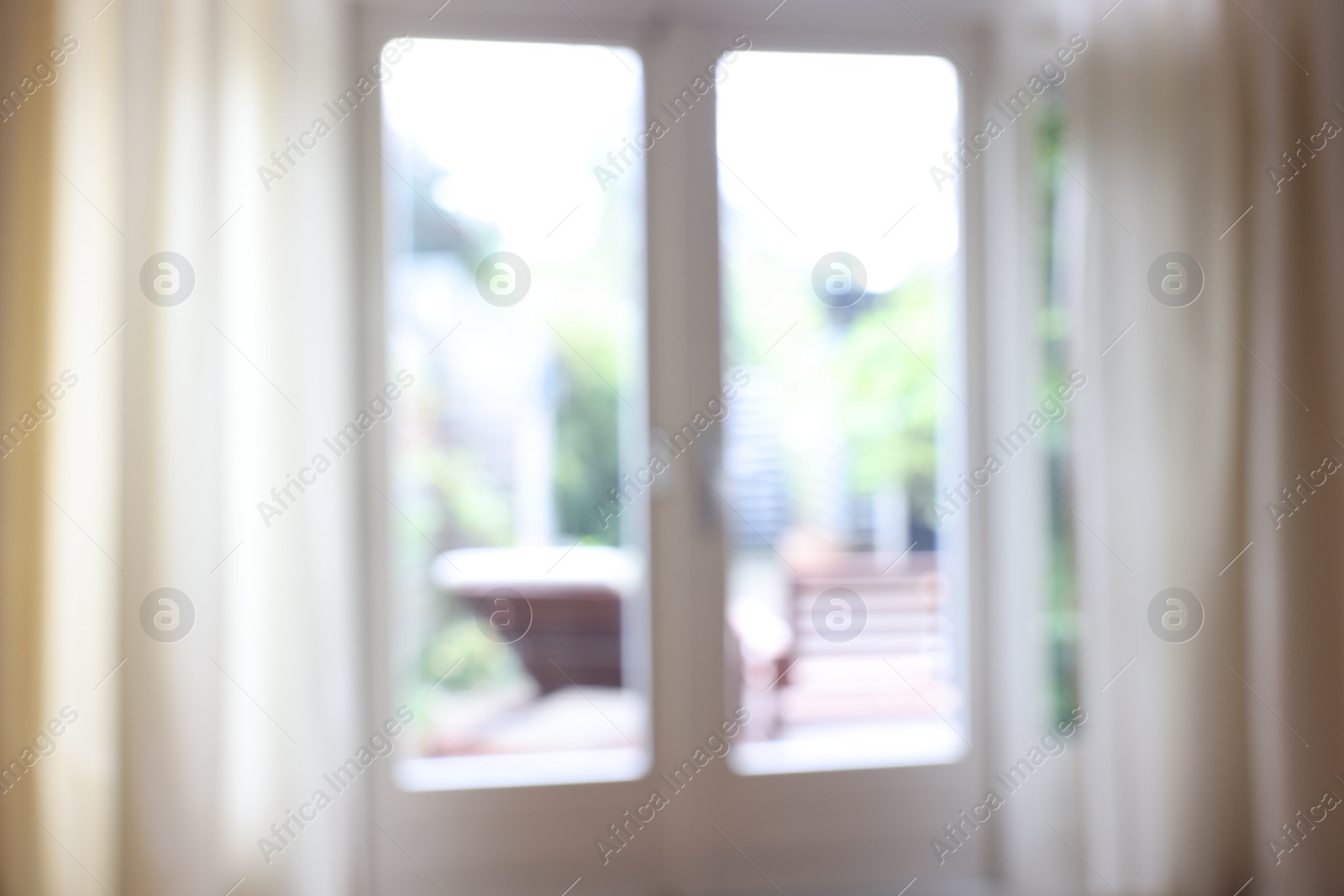 Photo of Blurred view of glass door at home