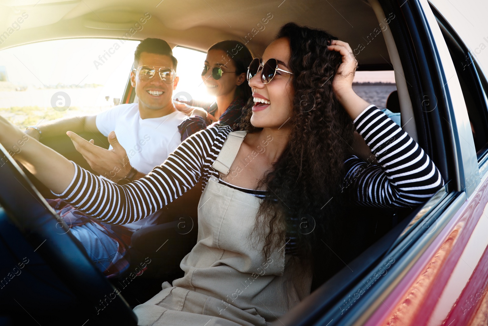 Photo of Happy friends together in car on road trip