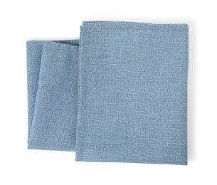 Photo of New clean light blue cloth napkins isolated on white, top view