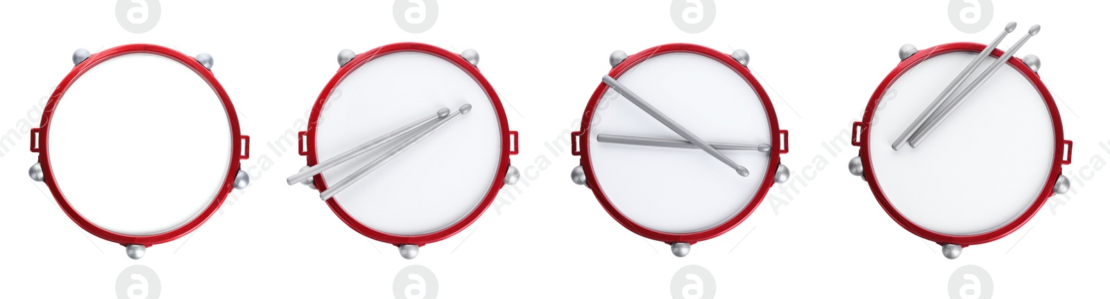 Image of Bright toy drums and sticks on white background, top view