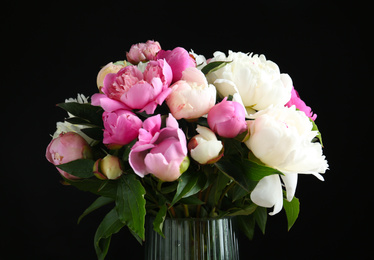 Photo of Bouquet of beautiful fresh peonies on black background, closeup