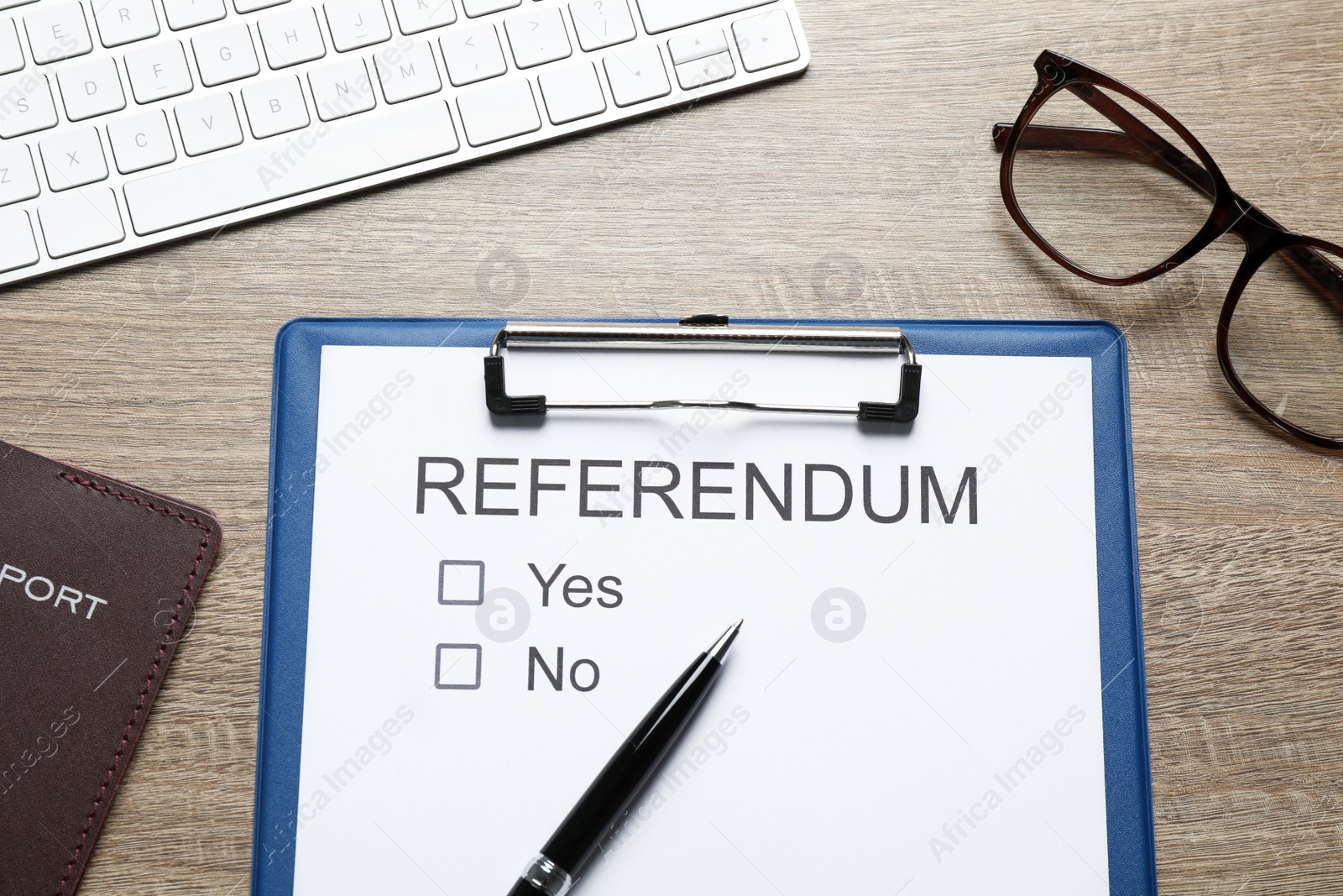 Photo of Flat lay composition with referendum ballot on wooden table