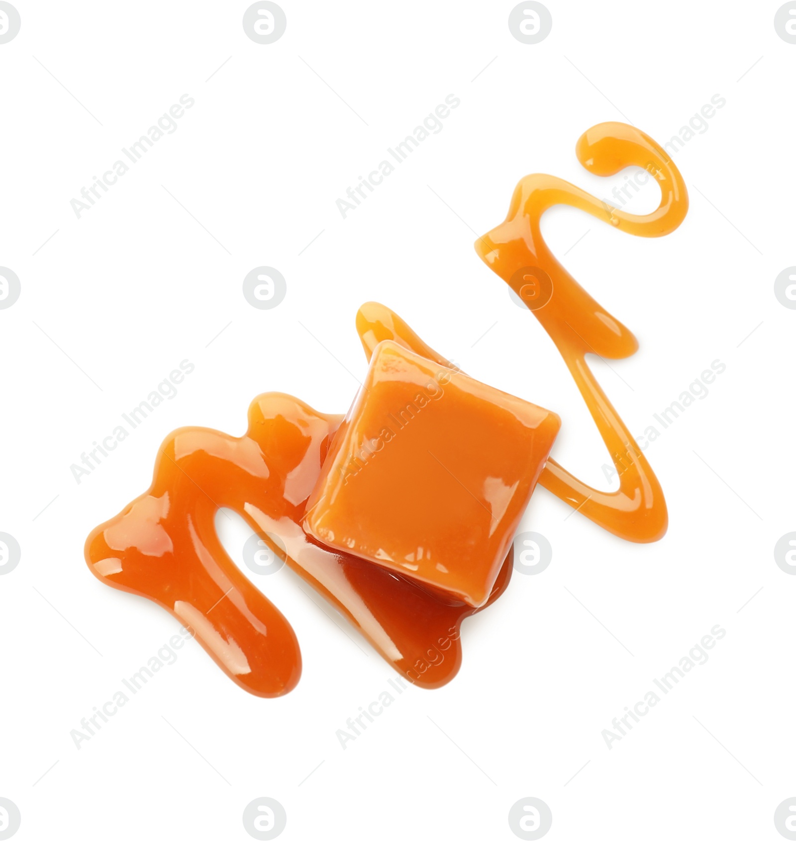 Photo of Sweet caramel candy with topping isolated on white, top view