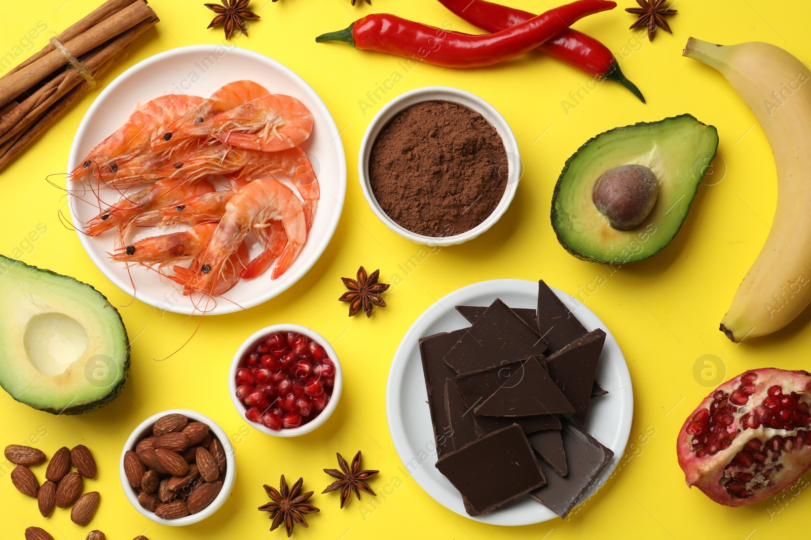 Photo of Natural aphrodisiac. Different food products on yellow background, flat lay