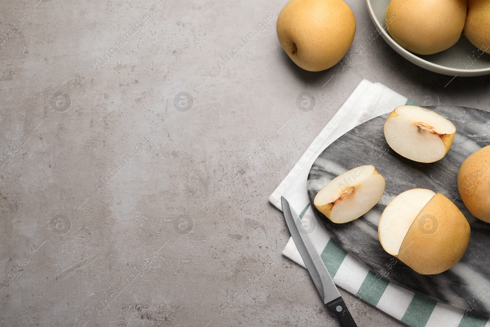 Photo of Fresh apple pears on grey table, flat lay. Space for text