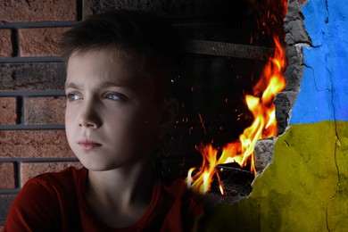Image of Sad little boy and wall of ruined building painted in color of national flag on fire. Stop war in Ukraine