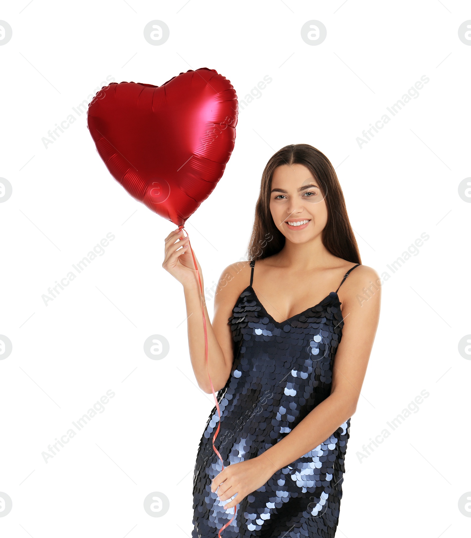 Photo of Portrait of young woman with heart shaped balloon on white background