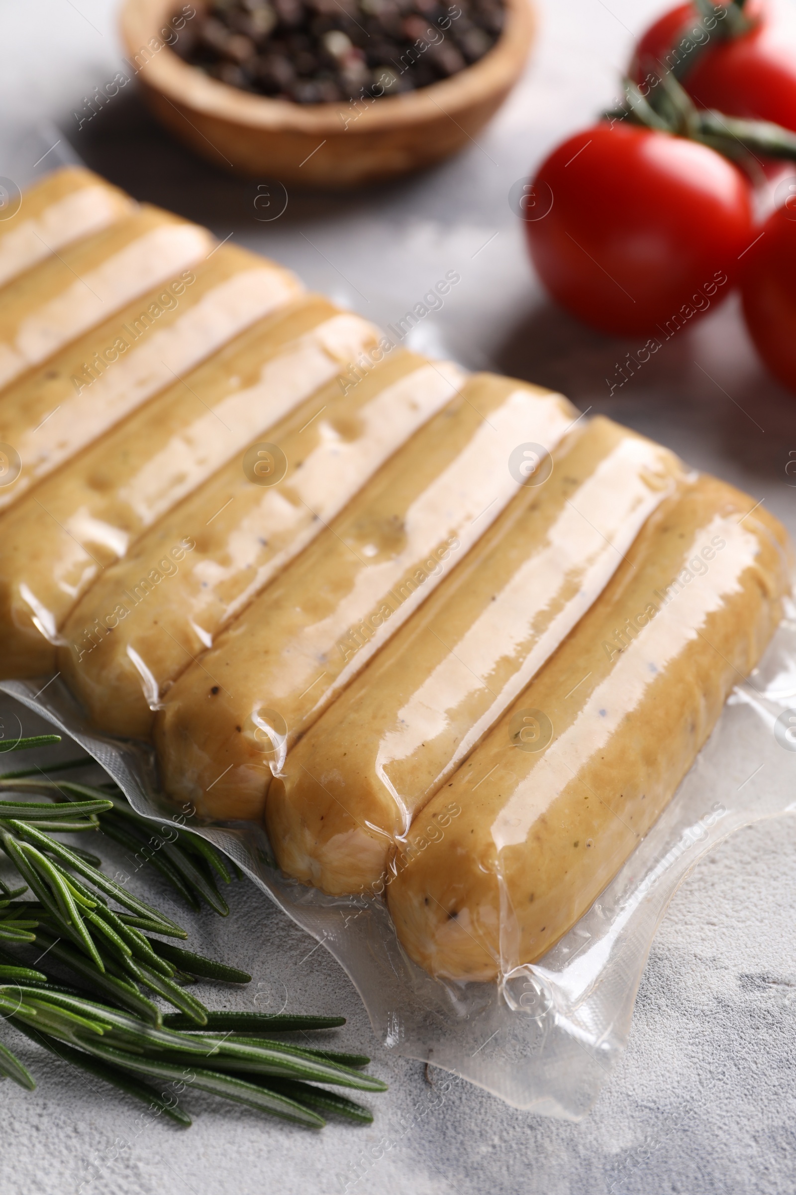 Photo of Vegan sausages and products on white table, closeup