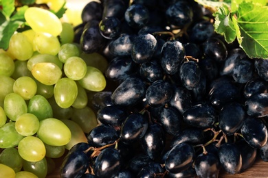 Fresh ripe juicy grapes on table, closeup