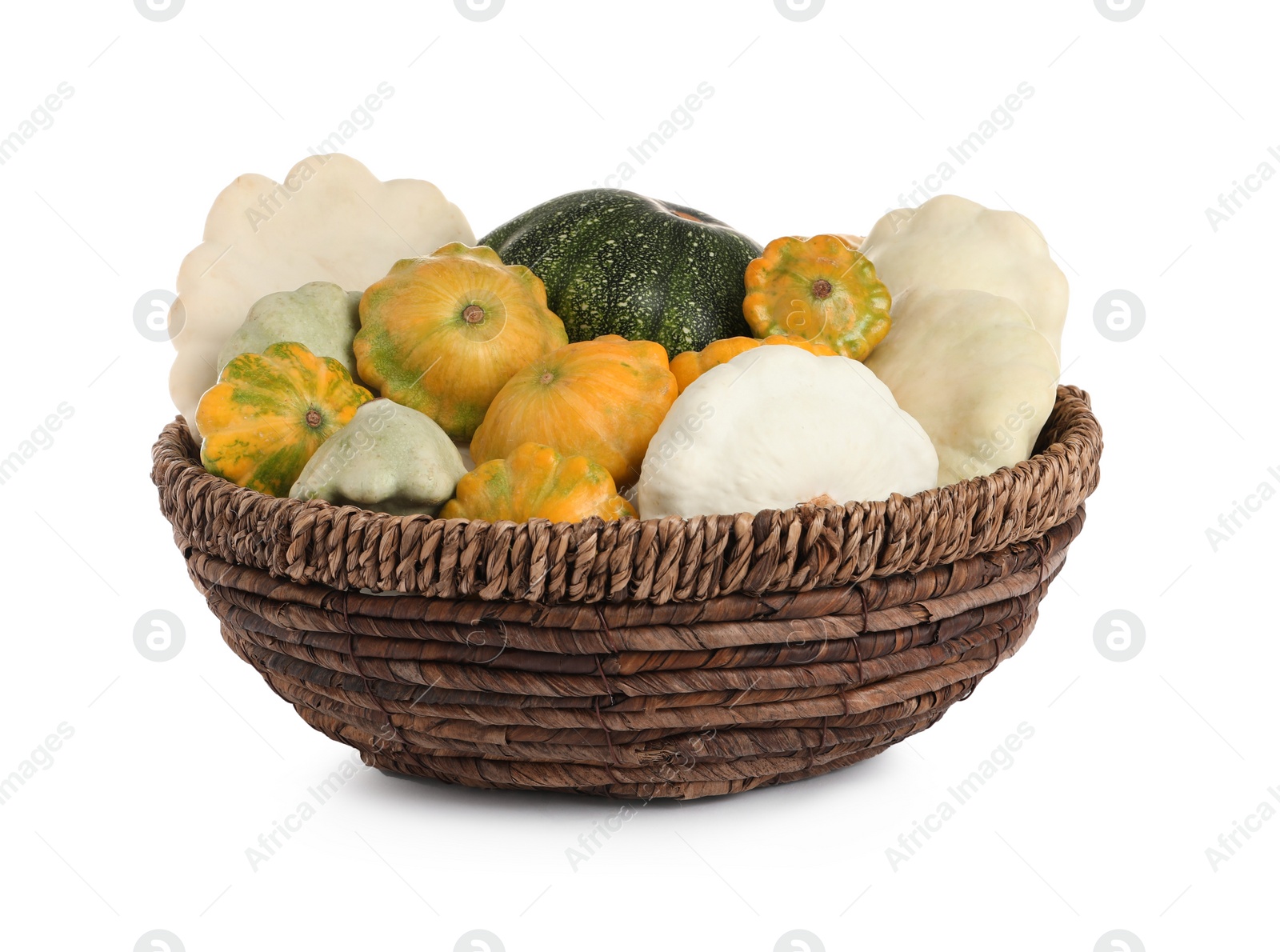 Photo of Fresh ripe pattypan squashes in wicker bowl on white background