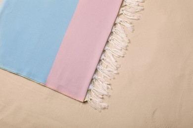 Photo of Soft beach towel on sand, top view
