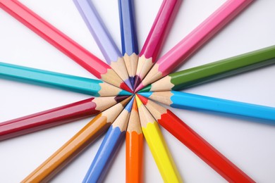 Photo of Colorful wooden pencils on white background, flat lay