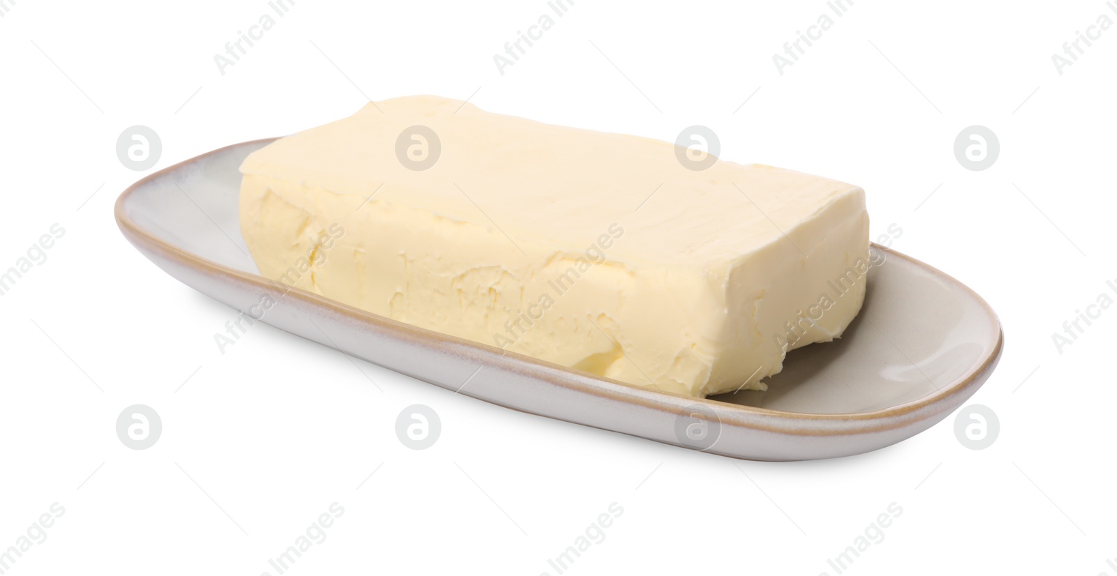 Photo of Block of tasty butter in dish isolated on white