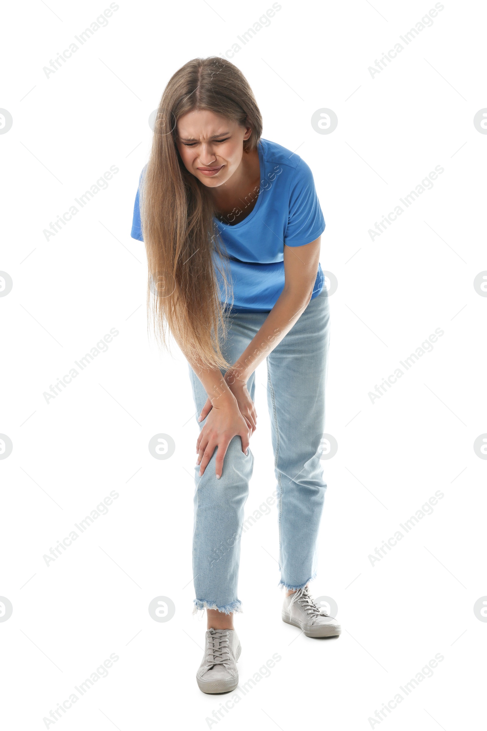 Photo of Full length portrait of woman having knee problems on white background